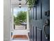 Welcoming entryway with a stylish front door, offering a glimpse of the charming front porch and neighborhood at 205 White Gables Dr, Summerville, SC 29483