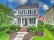 Charming two-story home featuring a cozy front porch, manicured lawn, and a welcoming landscaped yard at 205 White Gables Dr, Summerville, SC 29483