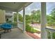 Charming front porch features a cozy papasan chair, offering a comfortable spot for outdoor relaxation at 205 White Gables Dr, Summerville, SC 29483
