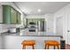 Kitchen with green accent cabinets, stainless appliances, and granite countertops at 205 White Gables Dr, Summerville, SC 29483