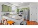 A kitchen with stainless steel appliances, granite countertops, and green cabinetry at 205 White Gables Dr, Summerville, SC 29483