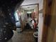 Compact bathroom with a toilet, shower and grab bars at 207 Cedar St, Saint George, SC 29477
