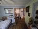 Bedroom featuring light blue walls and hardwood floors at 207 Cedar St, Saint George, SC 29477