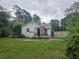 Charming home exterior with a front porch and a quaint, classic design at 207 Cedar St, Saint George, SC 29477