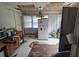 Bright kitchen featuring white appliances and cabinetry, and eat-in area at 207 Cedar St, Saint George, SC 29477