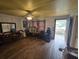 Large living room featuring hardwood floors and a ceiling fan at 207 Cedar St, Saint George, SC 29477