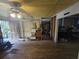 Open living room with hardwood floors and a ceiling fan at 207 Cedar St, Saint George, SC 29477