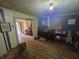 Wide living area with hardwood floors, natural light, and access to another space at 207 Cedar St, Saint George, SC 29477