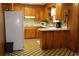 Functional kitchen with wood cabinetry, white appliances, and practical layout at 2163 Pinehurst Ave, Charleston, SC 29414