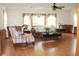 Bright and airy living room featuring large windows and light hardwood floors at 2163 Pinehurst Ave, Charleston, SC 29414