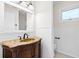 Bathroom featuring a vanity with an ornate cabinet and marble countertop, complemented by bright white beadboard at 22 Ogier St, Charleston, SC 29403