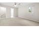 Bright bedroom with neutral carpet, ceiling fan, and a window at 22 Ogier St, Charleston, SC 29403
