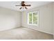 Bedroom boasts a neutral carpet and a window at 22 Ogier St, Charleston, SC 29403