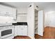 Kitchen features white cabinets, appliances, and a pantry at 22 Ogier St, Charleston, SC 29403