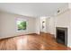 Bright living room featuring hardwood floors, fireplace, and plenty of natural light at 22 Ogier St, Charleston, SC 29403