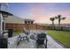 Backyard featuring a stone fire pit, comfortable seating, and scenic views of the surrounding community at 228 Lucca Dr, Summerville, SC 29486