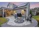 Outdoor patio with a fire pit, grill, and screened-in porch, perfect for entertaining in comfort at 228 Lucca Dr, Summerville, SC 29486