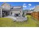 Backyard oasis featuring a stone fire pit and cozy seating at 228 Lucca Dr, Summerville, SC 29486