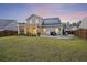 Spacious backyard with a patio, fire pit, and solar panels on the roof at 228 Lucca Dr, Summerville, SC 29486