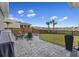 Outdoor area with a paver patio, fire pit, Adirondack chairs and views of the community pond at 228 Lucca Dr, Summerville, SC 29486