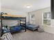 Shared bedroom featuring a bunk bed, twin bed, and bean bag chairs, perfect for children at 228 Lucca Dr, Summerville, SC 29486