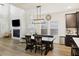 Dining room and living room with fireplace in an open floorplan with high ceilings at 228 Lucca Dr, Summerville, SC 29486