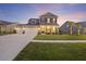 Charming two-story home with a three-car garage and beautifully landscaped front yard at 228 Lucca Dr, Summerville, SC 29486