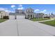 Charming two-story home with a two-car garage and a well-manicured front yard at 228 Lucca Dr, Summerville, SC 29486