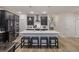 Open concept kitchen features an island with barstool seating and stainless steel appliances at 228 Lucca Dr, Summerville, SC 29486