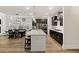 Gourmet kitchen with quartz island, stainless appliances, and modern lighting at 228 Lucca Dr, Summerville, SC 29486