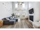 Bright living room with high ceilings, a fireplace, and a sliding door with outdoor view at 228 Lucca Dr, Summerville, SC 29486