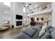 Open-concept living room with fireplace, upstairs landing and kitchen, in an open floorplan at 228 Lucca Dr, Summerville, SC 29486