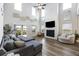 Spacious living room with high ceilings, fireplace, and sliding glass doors to the patio at 228 Lucca Dr, Summerville, SC 29486