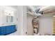 Bright bathroom with shaker vanity, and ample storage, adjacent to a closet filled with home goods, showing the functionality at 2312 Rushland Landing Rd, Johns Island, SC 29455