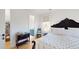Bright bedroom with wooden floors, stylish decor, and a view into the ensuite bathroom at 2312 Rushland Landing Rd, Johns Island, SC 29455