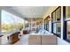Relaxing porch with comfortable seating, offering an inviting outdoor space for gatherings and enjoying nature at 2312 Rushland Landing Rd, Johns Island, SC 29455