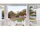 Elevated view of the neighborhood through the front porch pillars and stairs of this beautiful home at 2312 Rushland Landing Rd, Johns Island, SC 29455
