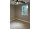 Comfortable bedroom featuring tile floors, neutral walls, and one window at 2327 Bailey Dr, North Charleston, SC 29405