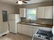 Bright kitchen featuring white cabinets, butcher block countertops, and modern appliances at 2327 Bailey Dr, North Charleston, SC 29405