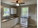 Bright kitchen featuring white cabinets, butcher block countertops, and modern appliances at 2327 Bailey Dr, North Charleston, SC 29405
