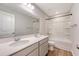 Bathroom with double sink vanity, a large mirror, and a shower-tub combo at 242 Torslanda Ln, Summerville, SC 29486
