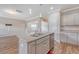 Beautiful kitchen island with sink and cabinets, connecting the kitchen and the living room at 242 Torslanda Ln, Summerville, SC 29486