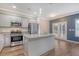 Modern kitchen with stainless steel appliances, granite countertops, and a stylish island at 242 Torslanda Ln, Summerville, SC 29486