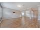 Inviting living room with hardwood floors, natural light, and TV mount ready for entertaining at 242 Torslanda Ln, Summerville, SC 29486