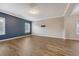 Comfortable living room featuring hardwood floors and modern color accent wall, bright and airy at 242 Torslanda Ln, Summerville, SC 29486
