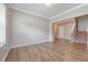 Bright living room featuring hardwood floors, crown molding, and an open floor plan at 242 Torslanda Ln, Summerville, SC 29486