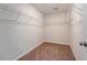 Walk-in closet featuring carpet flooring and wire shelving along the walls at 242 Torslanda Ln, Summerville, SC 29486