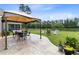 Outdoor living space featuring a covered patio, outdoor furniture, and a backyard view of a lake at 255 Decatur Dr, Summerville, SC 29486