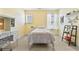 Bedroom with yellow walls, carpeted floor, and a desk area for studying or hobbies at 255 Decatur Dr, Summerville, SC 29486
