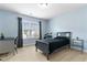 Bright bedroom featuring a cozy bed, large window, and blue walls at 255 Decatur Dr, Summerville, SC 29486